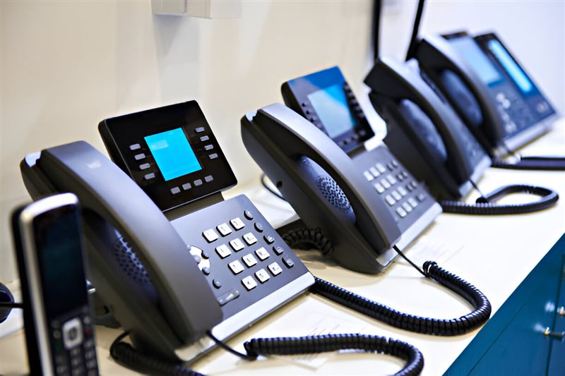 A row of pre-configured IP desk phones